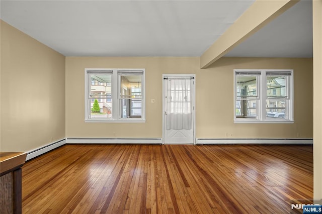 115 12th St, Prospect Park, NJ 07508 - entrance foyer with hardwood / wood-style floors, plenty of natural light, and baseboard heating