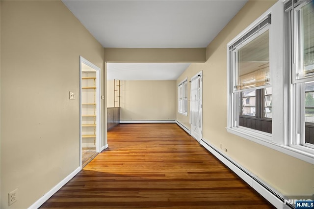 115 12th St, Prospect Park, NJ 07508 - hallway featuring a baseboard radiator and wood finished floors