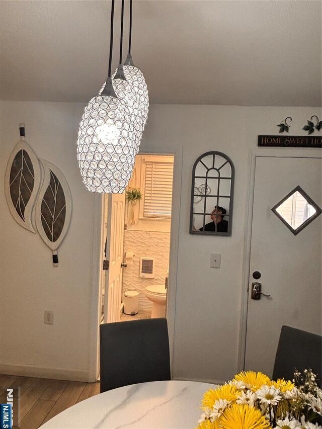 188 Hoyt St, Kearny, NJ 07032 - dining area featuring wood finished floors and a chandelier