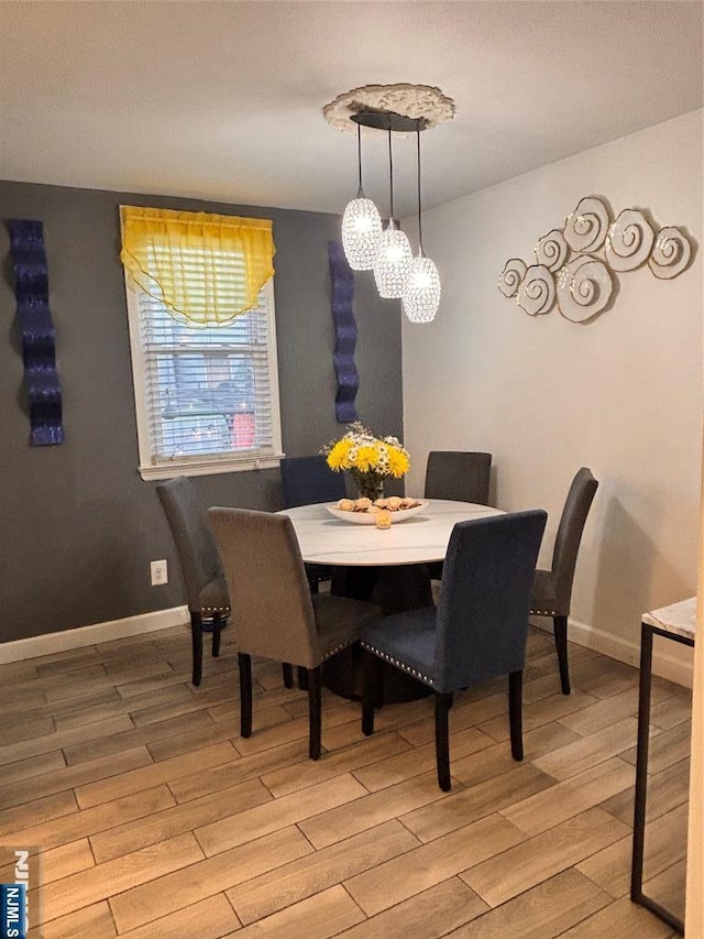 188 Hoyt St, Kearny, NJ 07032 - dining room with light wood-style floors and a chandelier
