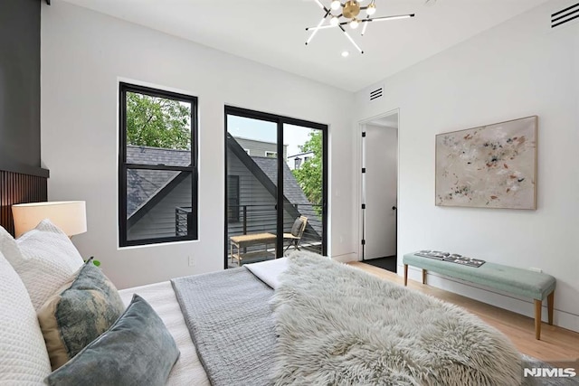 29 Armstrong Ave Unit 3, Jersey City, NJ 07305 - bedroom with access to exterior, wood finished floors, and recessed lighting