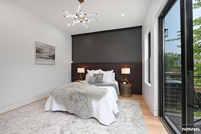 29 Armstrong Ave Unit 3, Jersey City, NJ 07305 - bedroom with a chandelier, light wood-type flooring, recessed lighting, and ceiling fan
