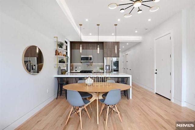 29 Armstrong Ave Unit 3, Jersey City, NJ 07305 - dining room with a chandelier, light wood-style flooring, and recessed lighting