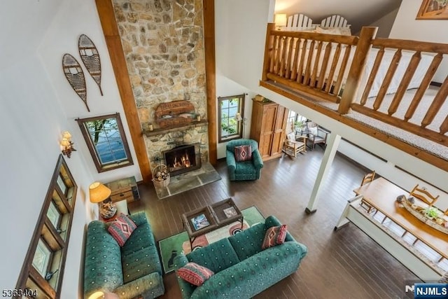 19 Division Ln, Byram, NJ 07821 - living room featuring a high ceiling, wood-type flooring, and a stone fireplace