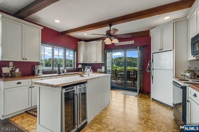 19 Division Ln, Byram, NJ 07821 - kitchen with freestanding refrigerator, range with electric cooktop, beamed ceiling, beverage cooler, and healthy amount of natural light