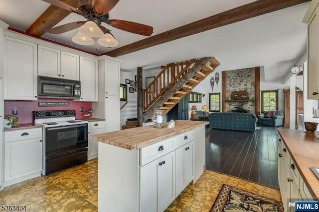 19 Division Ln, Byram, NJ 07821 - kitchen featuring black microwave, electric range, beam ceiling, butcher block countertops, and a ceiling fan