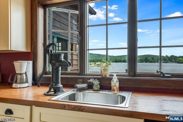 19 Division Ln, Byram, NJ 07821 - kitchen view of white cabinets and wood counters