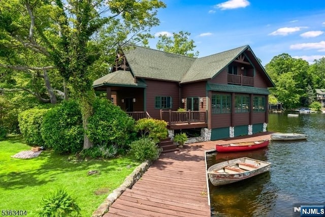 19 Division Ln, Byram, NJ 07821 - rear view of house featuring a water view, a yard, and a shingled roof