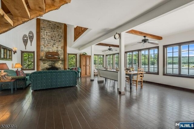 19 Division Ln, Byram, NJ 07821 - living room featuring plenty of natural light, hardwood / wood-style flooring, beam ceiling, a fireplace, and ceiling fan