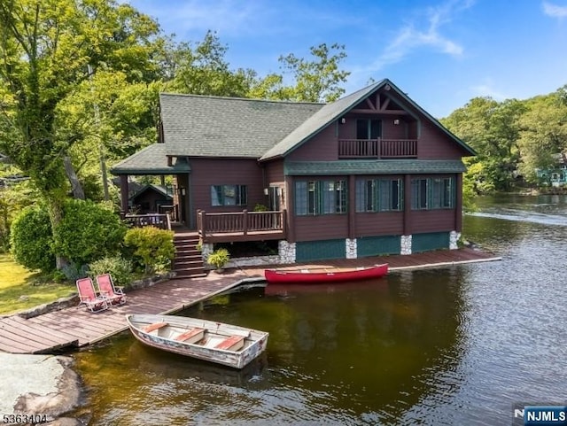 19 Division Ln, Byram, NJ 07821 - rear view of property featuring a water view, roof with shingles, stairs, and a balcony