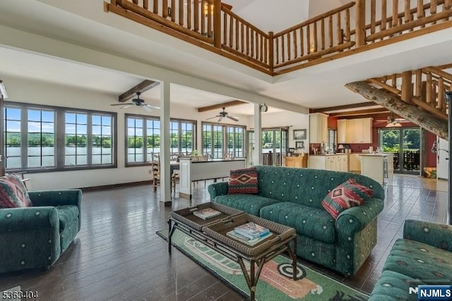 19 Division Ln, Byram, NJ 07821 - living room with plenty of natural light, dark wood-type flooring, a ceiling fan, a high ceiling, and beam ceiling