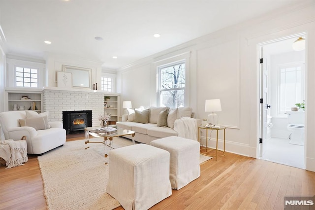 46 Oak Ridge Ave, Nutley, NJ 07110 - living area with crown molding, light wood-type flooring, healthy amount of natural light, and recessed lighting