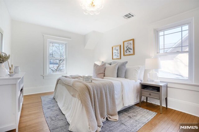 46 Oak Ridge Ave, Nutley, NJ 07110 - bedroom featuring multiple windows and light wood-style floors