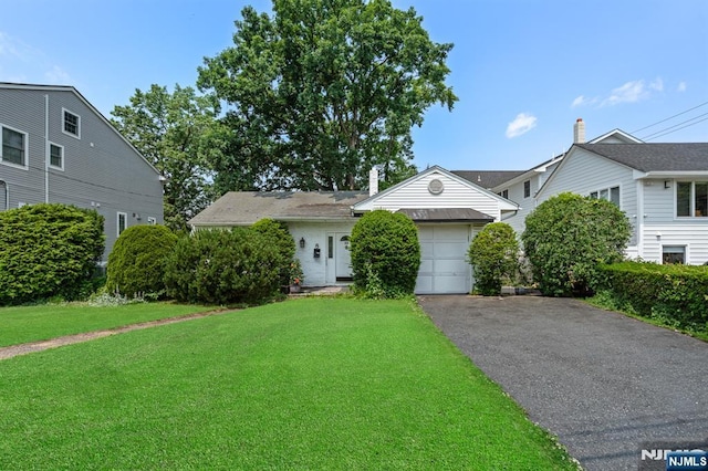 8 Hampton Rd, Clifton, NJ 07012 - view of front of home featuring a front yard, asphalt driveway, and an attached garage