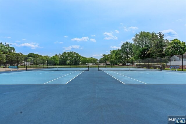 8 Hampton Rd, Clifton, NJ 07012 - view of tennis court with community basketball court and view of scattered trees
