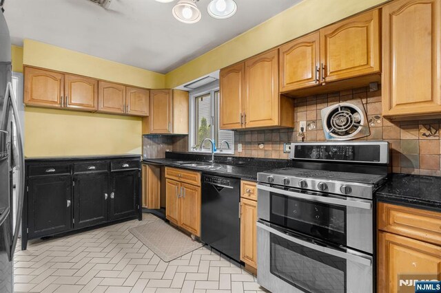 8 Hampton Rd, Clifton, NJ 07012 - kitchen with appliances with stainless steel finishes, tasteful backsplash, and dark stone countertops