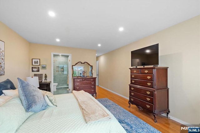 206 Wind Hollow Ct, Mahwah, NJ 07430 - bedroom with light wood-type flooring, recessed lighting, and ensuite bath