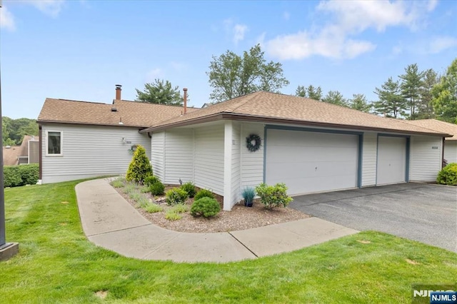 206 Wind Hollow Ct, Mahwah, NJ 07430 - view of front of house with a front lawn and an attached garage