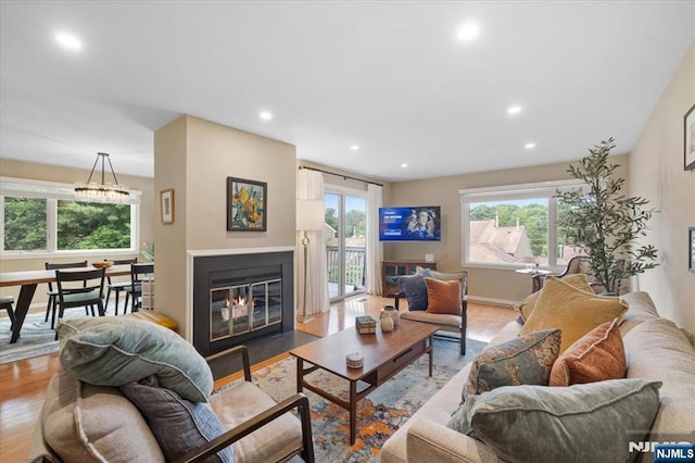 206 Wind Hollow Ct, Mahwah, NJ 07430 - living area featuring wood finished floors, recessed lighting, and a fireplace with flush hearth