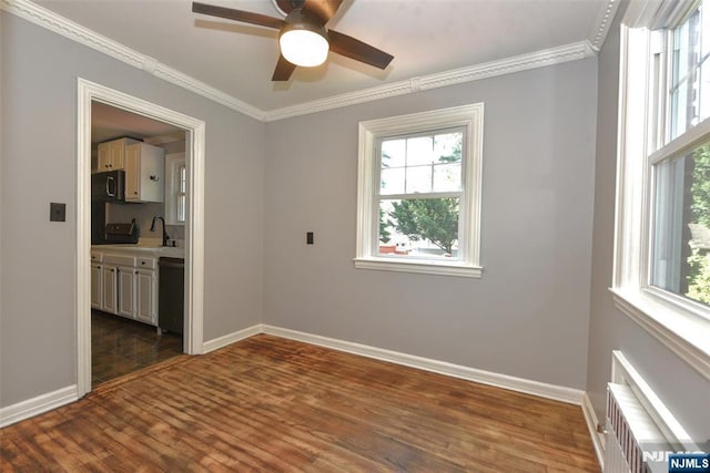 36 Grove St, Waldwick, NJ 07463 - spare room with ornamental molding, a ceiling fan, dark wood finished floors, and radiator