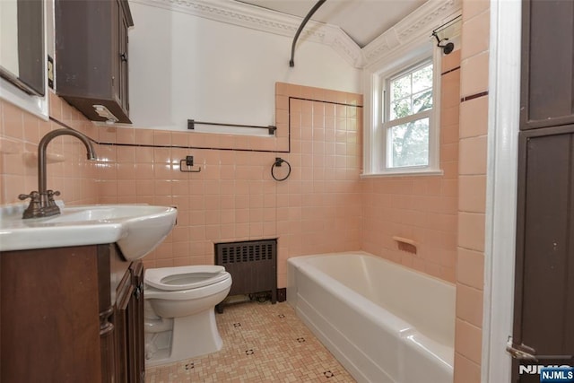 36 Grove St, Waldwick, NJ 07463 - full bath featuring radiator, vanity, a bath, tile patterned floors, and tile walls