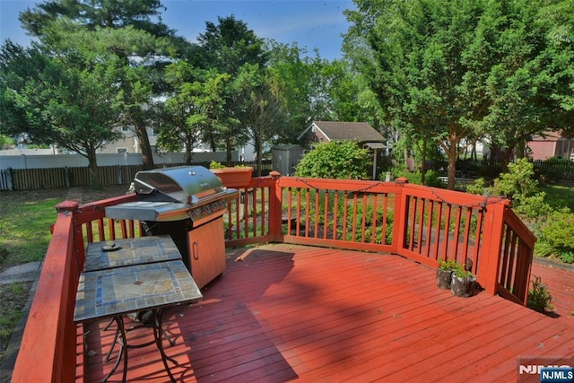 36 Grove St, Waldwick, NJ 07463 - wooden terrace featuring outdoor dining area, a storage shed, and grilling area