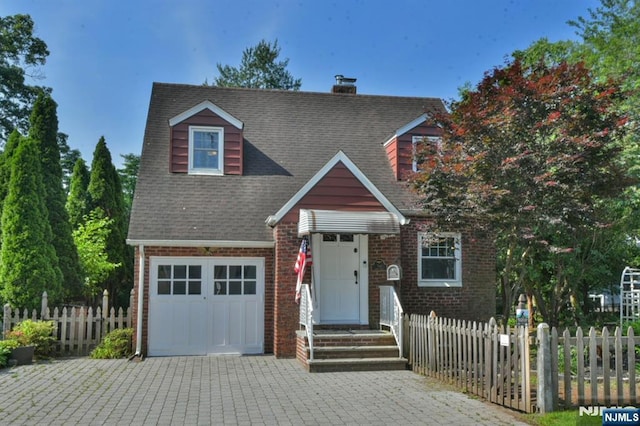 36 Grove St, Waldwick, NJ 07463 - view of front of home featuring brick siding, a chimney, driveway, and roof with shingles
