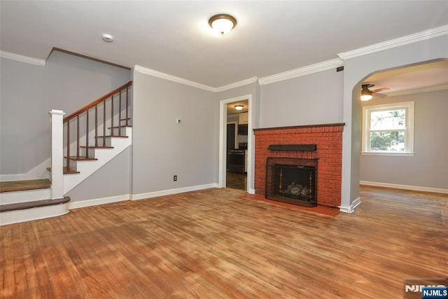 36 Grove St, Waldwick, NJ 07463 - unfurnished living room with wood finished floors, stairway, crown molding, a fireplace, and ceiling fan
