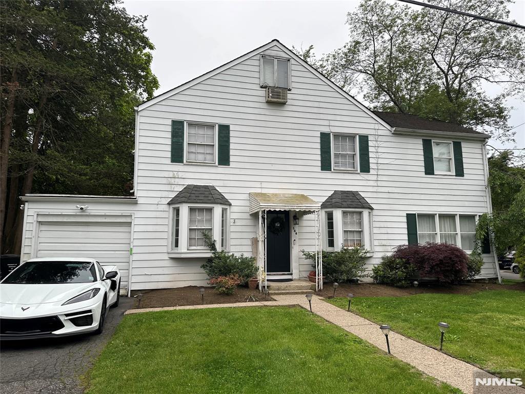 364 Kenwood, Paramus, NJ 07652 - view of front of home with a garage, asphalt driveway, and a front yard