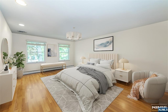 5 Hurley Ct, Wyckoff, NJ 07481 - bedroom featuring a baseboard radiator, light wood-type flooring, recessed lighting, and a chandelier