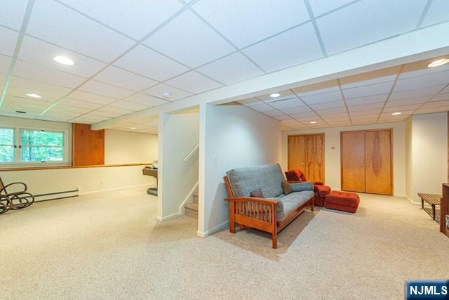 5 Hurley Ct, Wyckoff, NJ 07481 - living area with carpet, recessed lighting, a drop ceiling, stairway, and baseboard heating