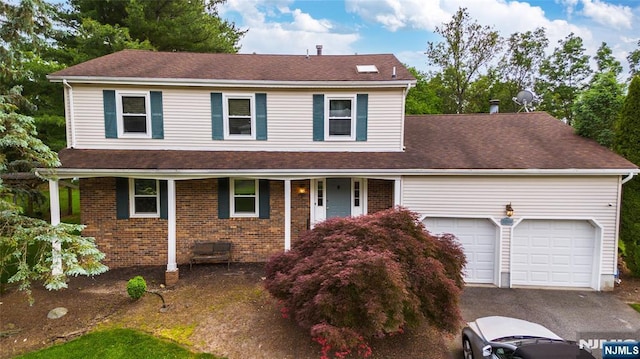 76 Point View Parkway, Wayne, NJ 07470 - traditional-style house featuring a porch, a garage, driveway, brick siding, and roof with shingles