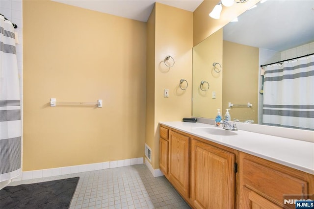 76 Point View Parkway, Wayne, NJ 07470 - full bath featuring vanity, tile patterned floors, a heating unit, and curtained shower