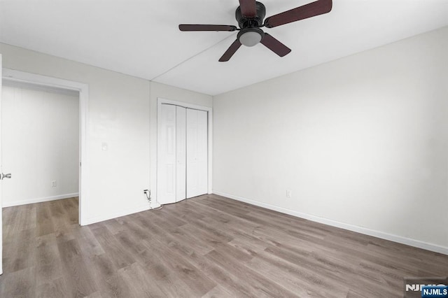 8829 Kennedy Blvd Unit E5, North Bergen, NJ 07047 - unfurnished bedroom featuring wood finished floors, a closet, and ceiling fan