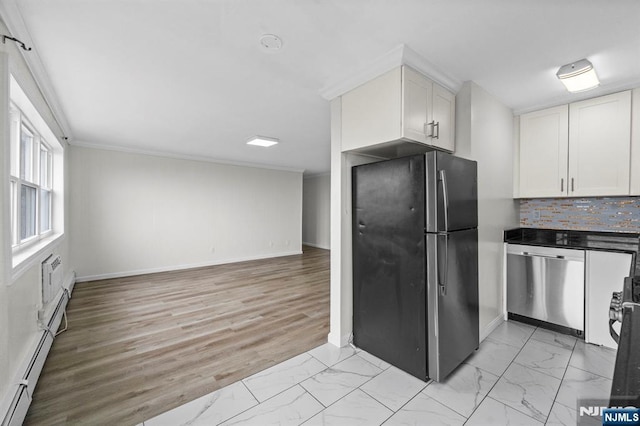 8829 Kennedy Blvd Unit E5, North Bergen, NJ 07047 - kitchen with stainless steel appliances, white cabinets, light marble finish flooring, crown molding, and decorative backsplash
