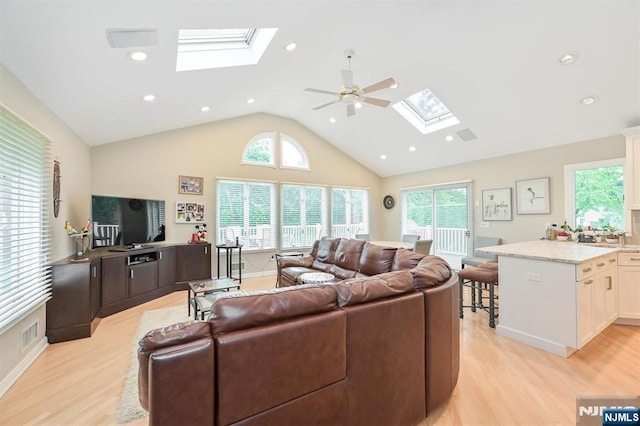 39 Terrace Rd, Wayne, NJ 07470 - living area featuring a skylight, light wood-style flooring, healthy amount of natural light, ceiling fan, and high vaulted ceiling