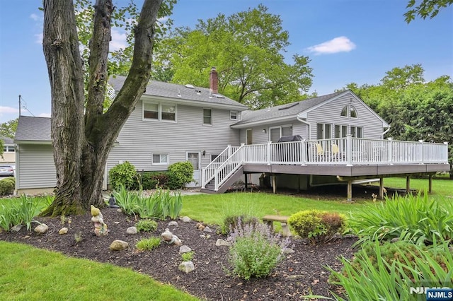 39 Terrace Rd, Wayne, NJ 07470 - back of property with a chimney, a deck, a lawn, stairs, and a shingled roof