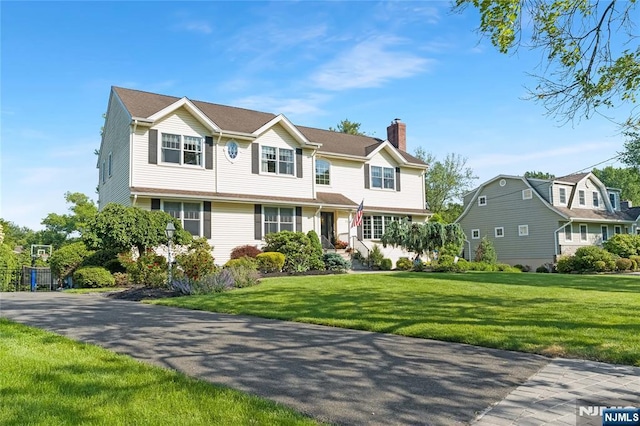 17 Windham Pl, Glen Rock, NJ 07452 - view of front of property featuring a chimney and a front yard