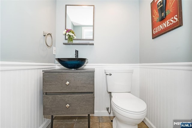 17 Windham Pl, Glen Rock, NJ 07452 - half bathroom featuring vanity and wainscoting