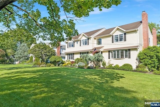 17 Windham Pl, Glen Rock, NJ 07452 - view of front of property featuring a chimney and a front lawn