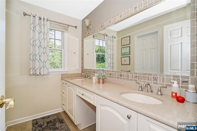17 Windham Pl, Glen Rock, NJ 07452 - full bath featuring double vanity and decorative backsplash