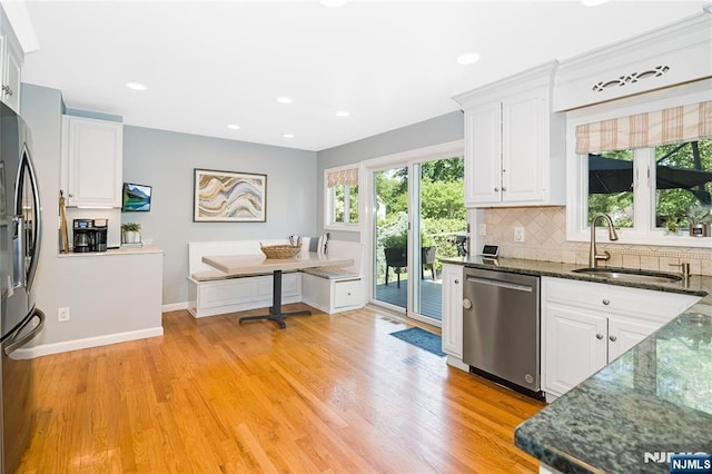 17 Windham Pl, Glen Rock, NJ 07452 - kitchen with stainless steel appliances, white cabinetry, decorative backsplash, light wood-style flooring, and recessed lighting