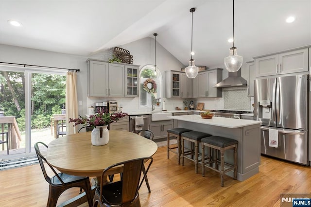 39 Division Ave, Hasbrouck Heights, NJ 07604 - kitchen with stainless steel appliances, gray cabinets, a center island, lofted ceiling, and recessed lighting