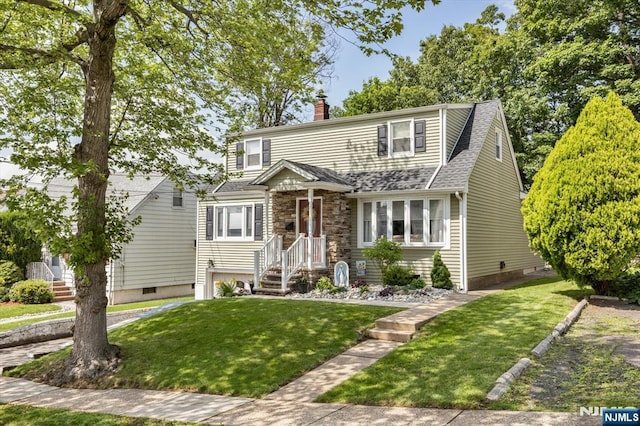 39 Division Ave, Hasbrouck Heights, NJ 07604 - view of front facade with a chimney, a front yard, and roof with shingles