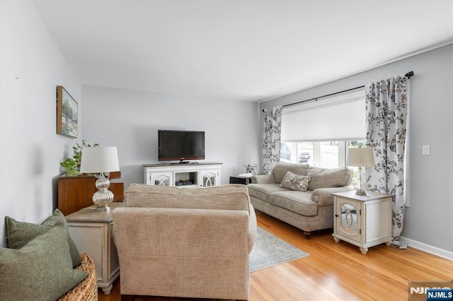 39 Division Ave, Hasbrouck Heights, NJ 07604 - living room featuring light wood finished floors and baseboards