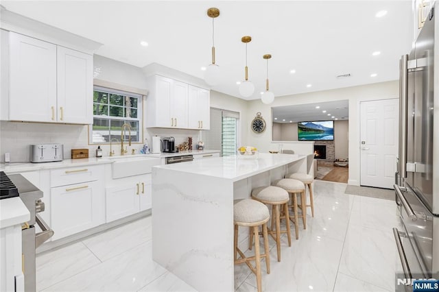 15 Kings Ct, Woodcliff Lake, NJ 07677 - kitchen with light marble finish flooring, tasteful backsplash, healthy amount of natural light, and recessed lighting