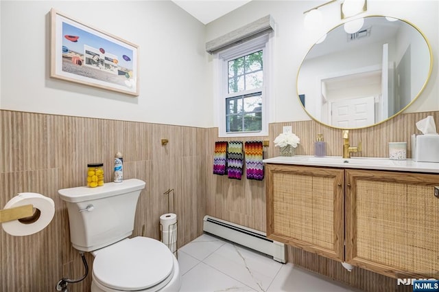 15 Kings Ct, Woodcliff Lake, NJ 07677 - bathroom with a baseboard heating unit, tile walls, vanity, and wainscoting