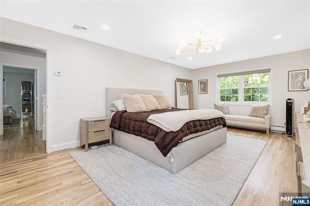 15 Kings Ct, Woodcliff Lake, NJ 07677 - bedroom featuring light wood finished floors, a chandelier, baseboard heating, and recessed lighting