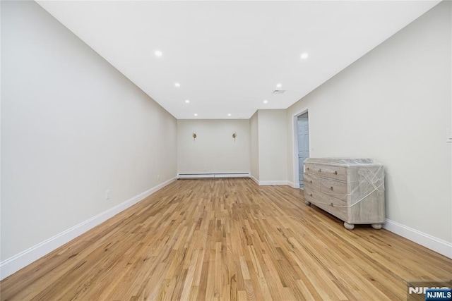 15 Kings Ct, Woodcliff Lake, NJ 07677 - spare room with light wood-style floors, recessed lighting, and baseboard heating