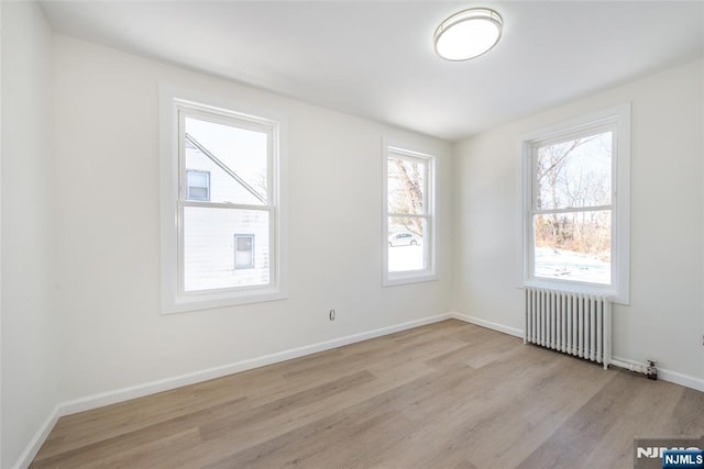 419 Central Ave, Haledon, NJ 07508 - empty room featuring radiator and wood finished floors